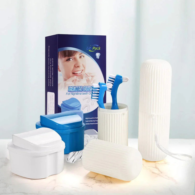 Dental care kit with two blue toothbrushes, teeth guards, and storage cases on white background